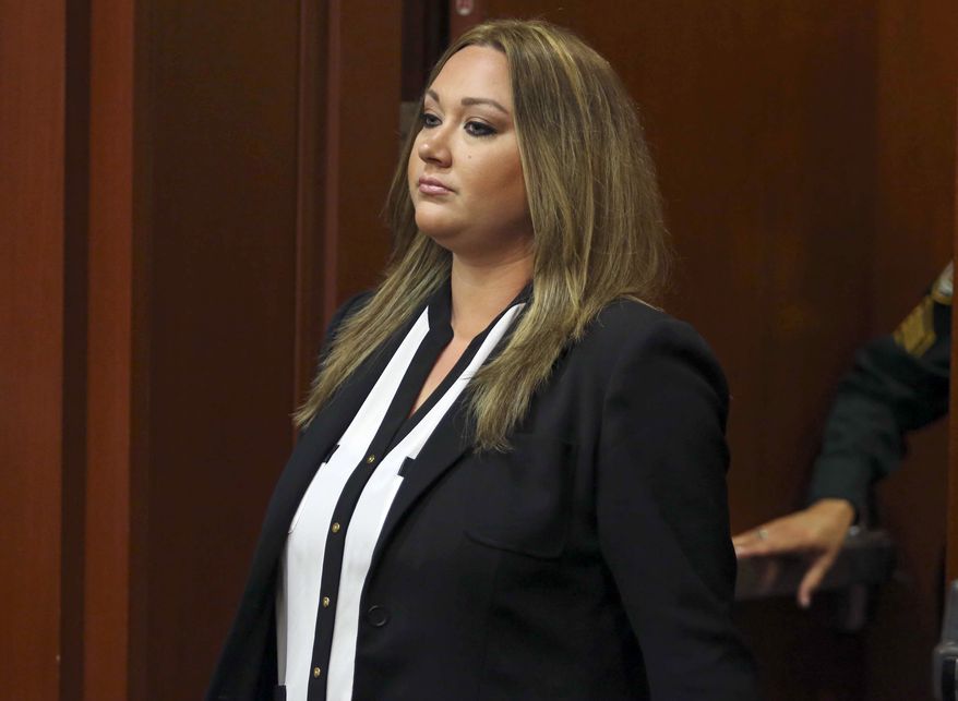 ** FILE ** Shellie Zimmerman pleads guilty at the Seminole County Courthouse in Sanford, Fla. on Aug. 28, 2013, to a misdemeanor perjury charge for lying during a bail hearing after her husband's arrest. She was sentenced to a year's probation and 100 hours of community service. (Associated Press/Orlando Sentinel)