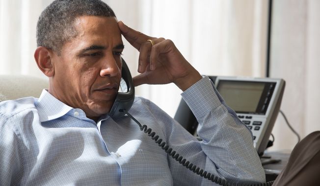 ** FILE ** President Obama speaks by phone with his National Security Staff regarding the situation in Egypt, while in Chilmark, Mass., Aug. 15, 2013. (Official White House Photo by Amanda Lucidon)