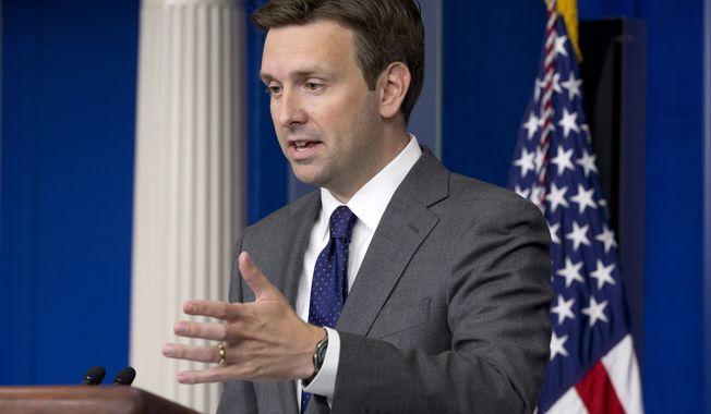Joshua Earnest, White House deputy press secretary, speaks to the media in the briefing room of the White House in Washington on Thursday, Aug. 29, 2013. (AP Photo/Jacquelyn Martin)