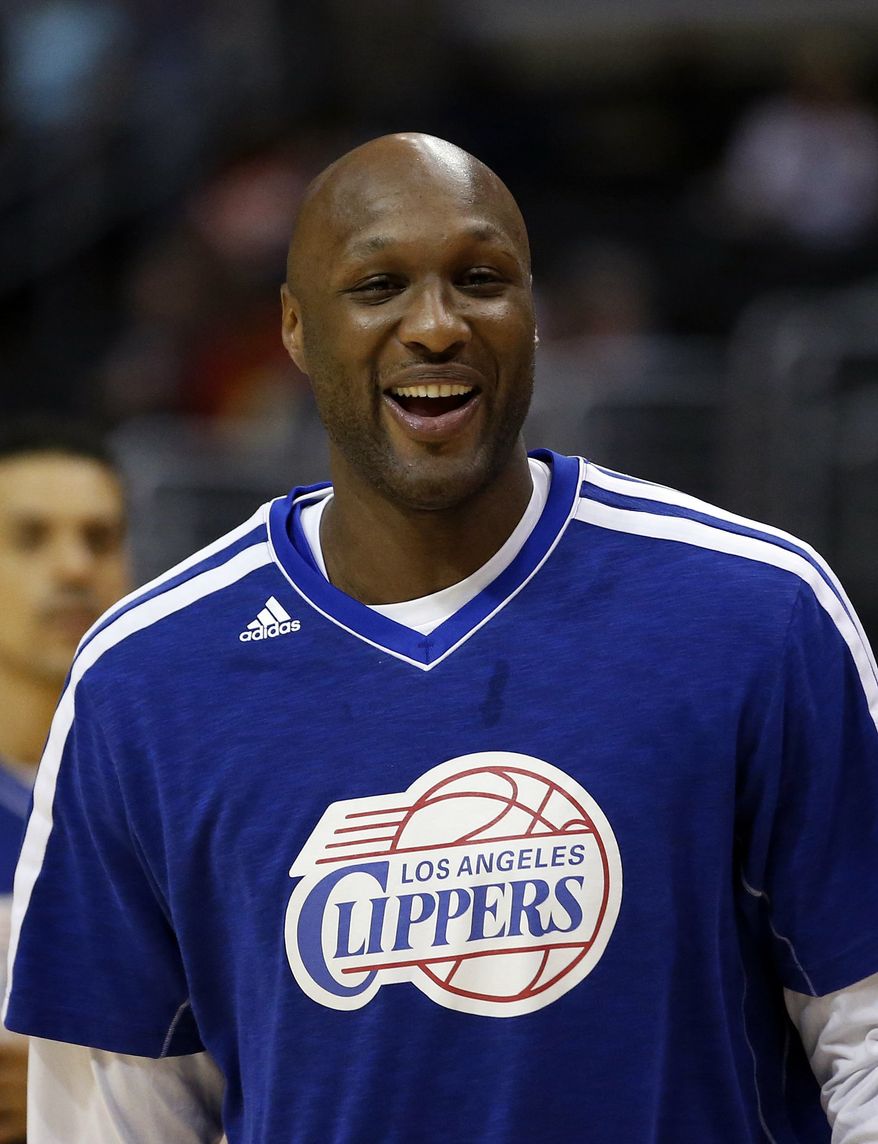 ** FILE ** In this March 13, 2013, file photo, Los Angeles Clippers' Lamar Odom smiles during NBA basketball practice in Los Angeles. Odom was arrested for allegedly driving under the influence early Friday, Aug. 30, 2013, after a CHP officer saw his white Mercedes-Benz traveling erratically on a San Fernando Valley freeway. The CHP says Odom, 33, was arrested after failing a field sobriety test. (AP Photo/Jae C. Hong, File)