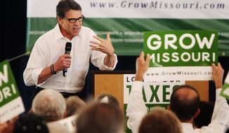 Texas Gov. Rick Perry speaks to business and Republican leaders in Chesterfield, Mo., in late August, warning them that unless there is an override of Gov. Jay Nixon&#39;s veto of an income-tax cut, he won&#39;t be the only governor trying to lure business away from Missouri. (St. Louis Post-Dispatch via Associated Press)