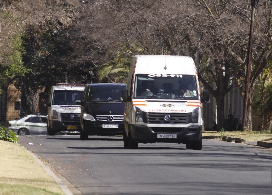 An ambulance transporting former South African President Nelson Mandela arrives at his home in Johannesburg on Sunday, Sept. 1, 2013. Mr. Mandela was hospitalized for almost three months fighting a recurring lung infection. (AP Photo/Denis Farrell)