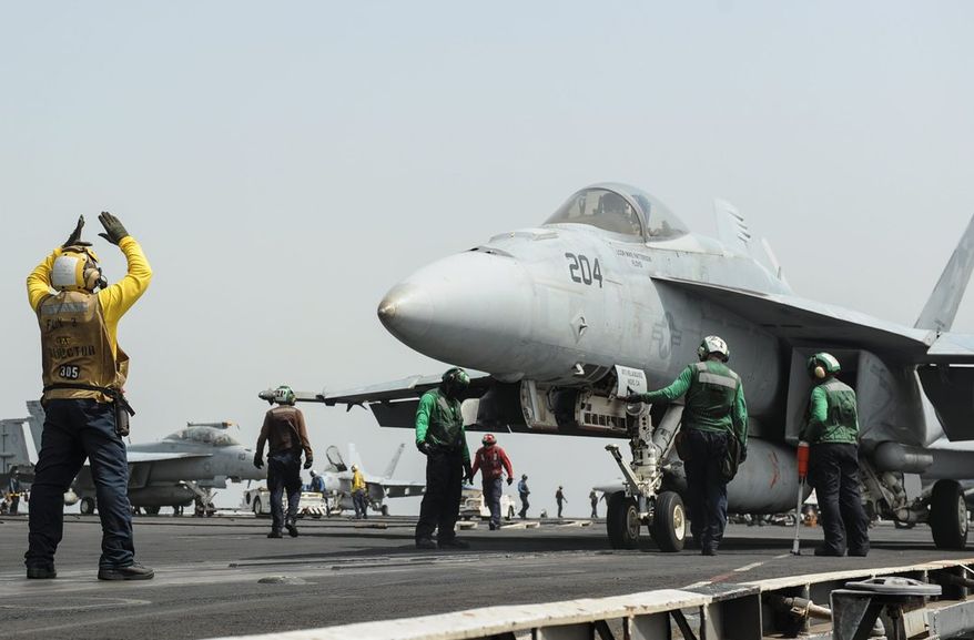 Ready: A Super Hornet is prepared to launch from the USS Nimitz. The carrier was scheduled to return home but was ordered to stay in the Red Sea. (U.S. Navy via associated press)