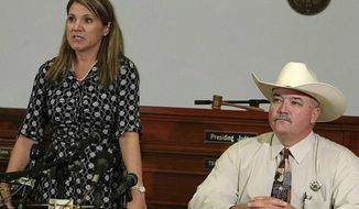 ** FILE ** 25th Judicial District Attorney Heather McMinn, left, and Lavaca County Sheriff Mica Harmon appear at a news conference in Halletsville, Texas on June 19, 2012. (Associated Press)

