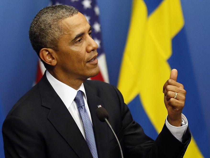 President Obama gestures during a press conference at Rosenbad, the Swedish government building, in Stockholm on Wednesday, Sept. 4, 2013. Mr. Obama is visiting Sweden at the invitation of Prime Minister Fredrik Reinfeldt ahead of the G-20 summit in St. Petersburg. (AP Photo/Frank Augstein)