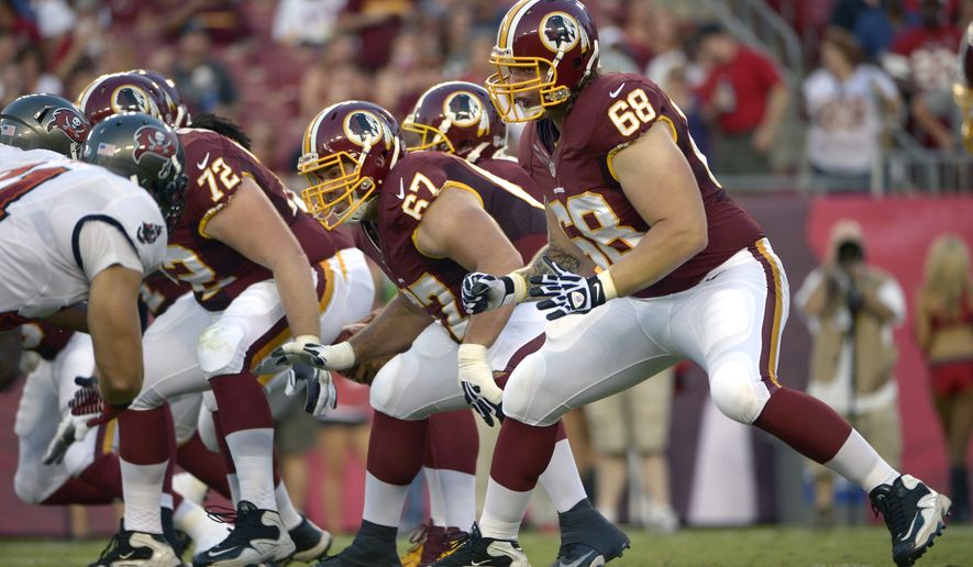 Washington Redskins guard Josh LeRibeus (67) and tackle Tom Compton (68) set up to block during the first half of a preseason NFL football game against the Tampa Bay Buccaneers in Tampa, Fla., Thursday, Aug. 29, 2013.(AP Photo/Phelan M. Ebenhack)
