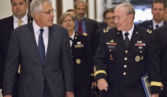 ** FILE ** Defense Secretary Chuck Hagel (left) and Army Gen. Martin E. Dempsey (right), chairman of the Joint Chiefs of Staff, arrive for a closed-door intelligence briefing for members of the Senate Armed Services Committee on Capitol Hill in Washington on Wednesday, Sept. 4, 2013. (AP Photo/J. Scott Applewhite)