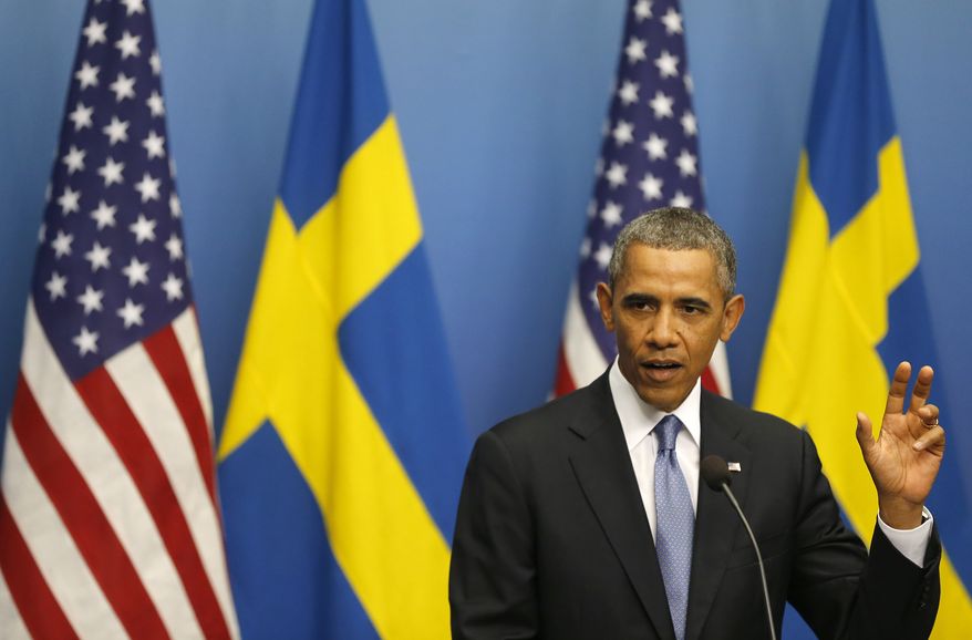 President Obama gestures during a press conference at Rosenbad, the seat of the Swedish government, in Stockholm on Wednesday, Sept. 4, 2013. Mr. Obama is on a visit to Sweden ahead of the G-20 summit in St. Petersburg. (AP Photo/Frank Augstein)