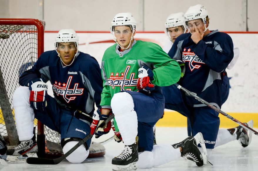 Forward Nathan Walker (79), center, takes a break with teammates during on-ice testing during the 2013 Capitals Rookie Camp at Kettler Capitals Iceplex, Arlington, Va., Thursday, September 5, 2013. (Andrew Harnik/The Washington Times)