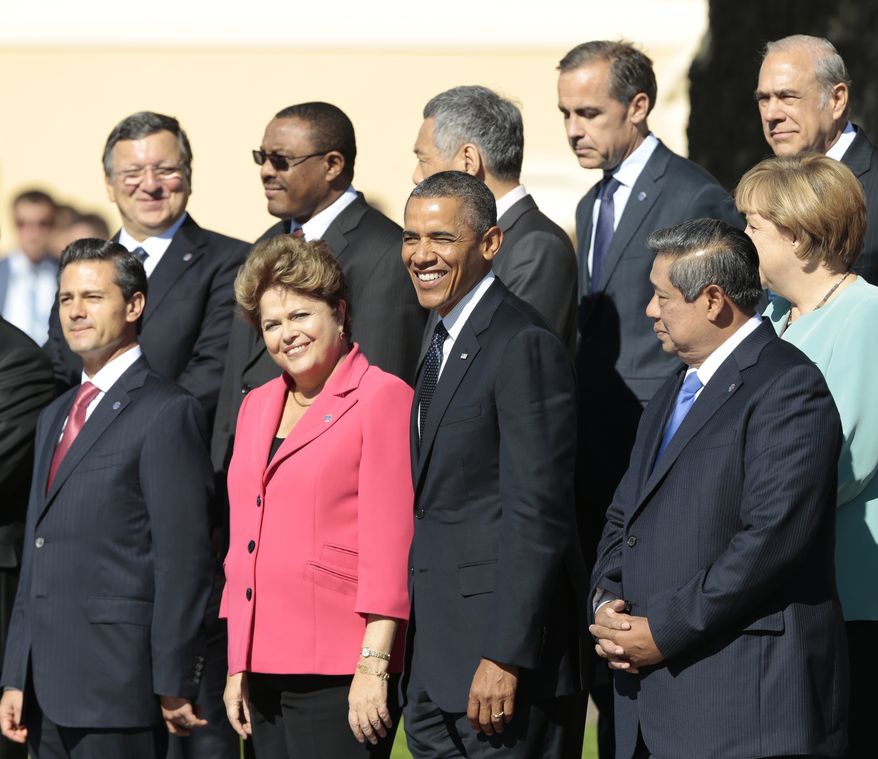 ** FILE ** U.S. President Barack Obama, front row center, smiles during a group photo of G-20 leaders outside of the Konstantin Palace in St. Petersburg, Russia on Friday, Sept. 6, 2013. Front row left to right, Mexico's President Enrique Pena Nieto, Brazil's President Dilma Rousseff and Indonesia's President Susilo Bambang Yudhoyono. (AP Photo/Ivan Sekretarev)