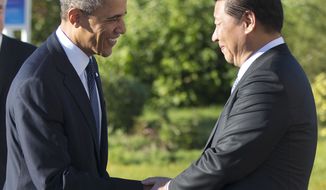U.S. President Barack Obama, left, and China&#39;s President Xi Jinping, right, shake hands before their bilateral meeting at the G-20 Summit, Friday, Sept. 6, 2013 in St. Petersburg, Russia. (AP Photo/Pablo Martinez Monsivais)