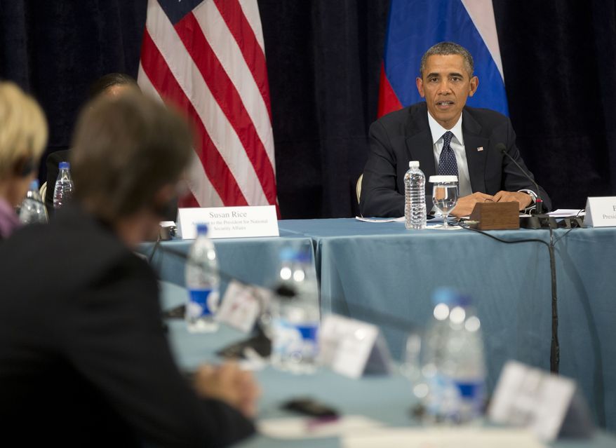 President Barack Obama participates in a "Civil Society Roundtable," Friday, Sept. 6, 2013, in St. Petersburg, Russia. At left is Igor Kochetkov chairman of the Russian LGBT Network. (AP Photo/Pablo Martinez Monsivais)
