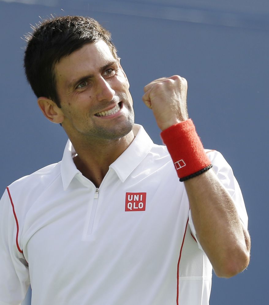 Novak Djokovic, of Serbia, reacts after winning a point against Stanislas Wawrinka, of Switzerland, during the semifinals of the 2013 U.S. Open tennis tournament, Saturday, Sept. 7, 2013, in New York. (AP Photo/Darron Cummings)