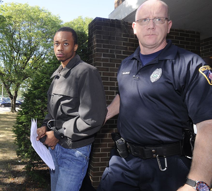 Dequan Breland (left) is led from a hearing in Wilkes-Barre, Pa., on Friday, Sept. 6, 2013, after being arrested in connection with the death of a New York City toddler shot in his stroller, according to authorities. Police located Mr. Breland, 23, and Dequan Wright, 19, at an apartment complex in Wilkes-Barre and arrested them without incident. (AP Photo/The Citizens' Voice, Mark Moran)