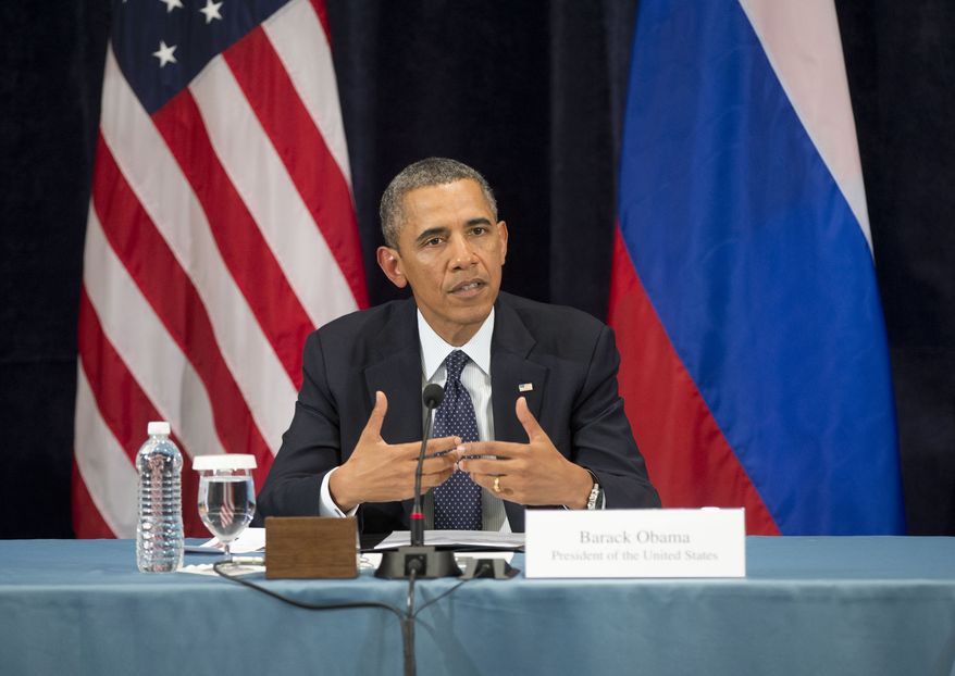 President Obama gestures while speaking during a Civil Society Roundtable with Russian gay, lesbian, bisexual and transgender activists on Friday, Sept. 6, 2013, in St. Petersburg. (AP Photo/Pablo Martinez Monsivais)