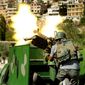 **FILE** In this photo released by the Syrian official news agency SANA, a Syrian military solider fires a heavy machine gun during clashes with rebels in Maaloula village, northeast of the capital Damascus, Syria, on Sept. 7, 2013. (Associated Press)