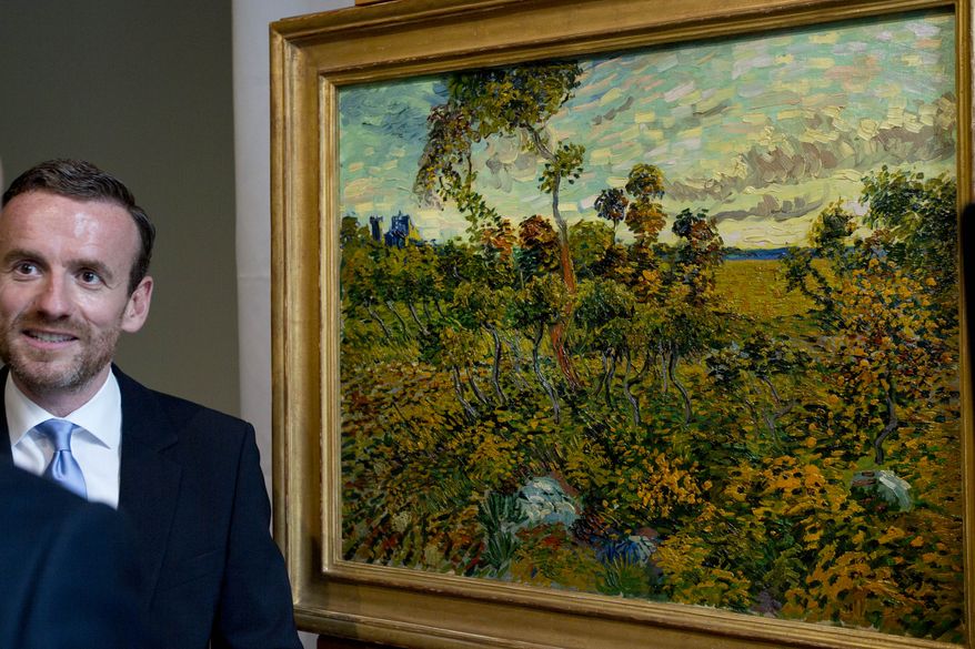 Van Gogh Museum Director Axel Ruger is interviewed as he stands next to the newly discovered "Sunset at Montmajour" by Dutch painter Vincent van Gogh during a press conference at the museum in Amsterdam on Monday, Sept. 9, 2013. The museum says it has identified the long-lost van Gogh painting, which spent years in a Norwegian attic, as the first full-size canvas by the Dutch master discovered since 1928. The painting belongs to an unidentified private collector, the museum says. (AP Photo/Peter Dejong)