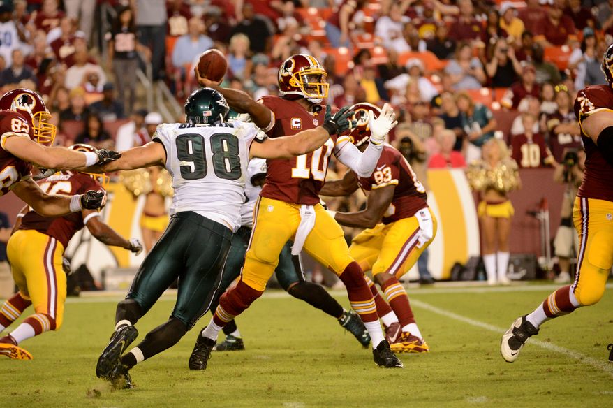 Washington Redskins quarterback Robert Griffin III (10) throws in the third quarter as the Washington Redskins play the Philadelphia Eagles in Monday Night NFL football at FedExField, Landover, Md., Monday, September 9, 2013. (Andrew Harnik/The Washington Times)
