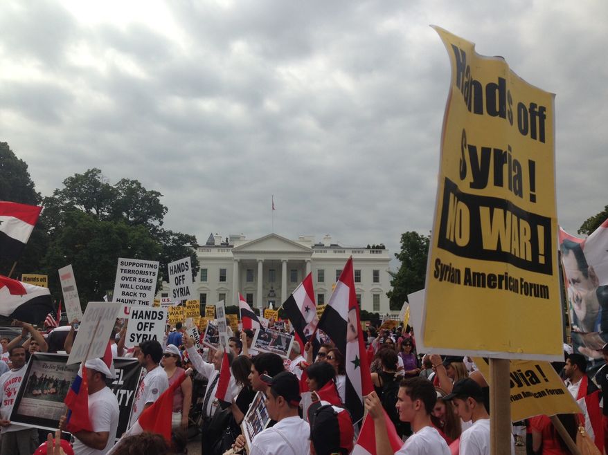 A crowd gathers in front of the White House to protest any military action against Syria, Monday, Sept. 9, 2013. (The Washington Times/Dave Boyer)