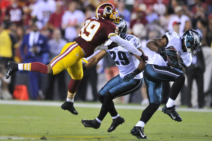 Philadelphia Eagles cornerback Brandon Boykin (22) intercepts a pass intended for Washington Redskins wide receiver Santana Moss (89) in the first quarter as the Washington Redskins play the Philadelphia Eagles in Monday Night NFL football at FedExField, Landover, Md., Monday, September 9, 2013. (Preston Keres / For The Washington Times)