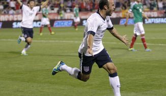 United States&#39; Landon Donovan celebrates his goal against Mexico during the second half of a World Cup qualifying soccer match Tuesday, Sept. 10, 2013, in Columbus, Ohio. The United States defeated Mexico 2-0. (AP Photo/Jay LaPrete)