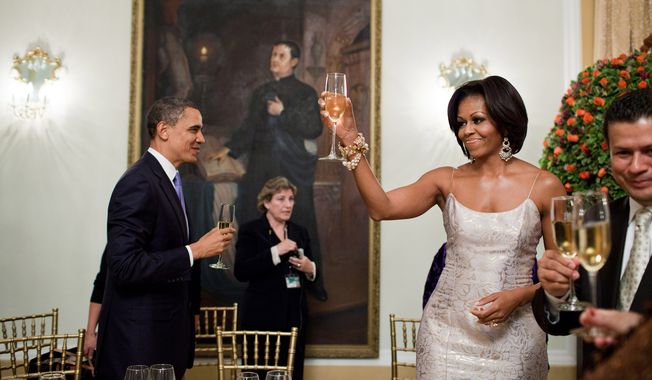 President Barack Obama and First Lady Michelle Obama toast during an official dinner hosted by Salvadoran President Mauricio Funes at the National Palace in San Salvador, El Salvador, March 22, 2011. (Official White House Photo by Pete Souza)