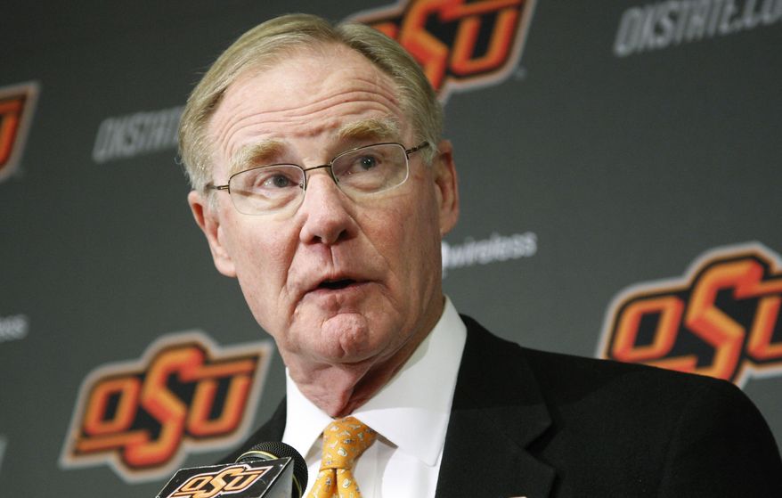 FILE - In this Friday, Nov. 18, 2011 file photo, Oklahoma State University president Burns Hargis speaks during a news conference in Stillwater, Okla. Chesapeake Energy Corp. shareholders showed their displeasure with the company's board by withholding support for two directors up for re-election at Friday's annual meeting. Both directors have tendered their resignation. Hargis is one of the two directors who resigned Friday. (AP Photo/Sue Ogrocki, File)