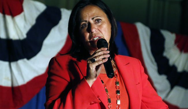Democratic state Sen. Angela Giron waves to supporters as she gives her concession speech after she lost in a recall vote in Pueblo, Colo., on Sept. 10, 2013. Giron was one of two Colorado state lawmakers who backed gun-control measures in the aftermath of the mass shootings in Colorado and Connecticut last year that have been ousted in recall elections. (Associated Press)