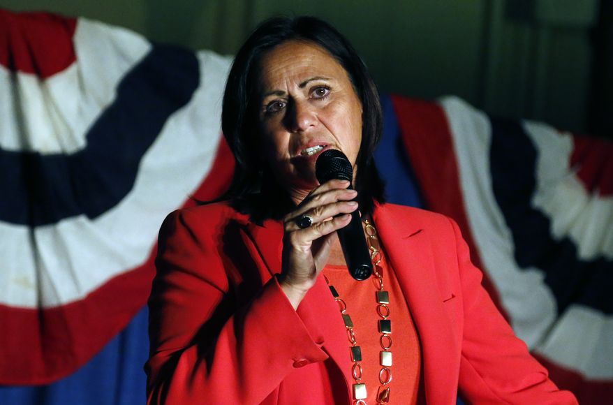 Democratic state Sen. Angela Giron waves to supporters as she gives her concession speech after she lost in a recall vote in Pueblo, Colo., on Sept. 10, 2013. Giron was one of two Colorado state lawmakers who backed gun-control measures in the aftermath of the mass shootings in Colorado and Connecticut last year that have been ousted in recall elections. (Associated Press)