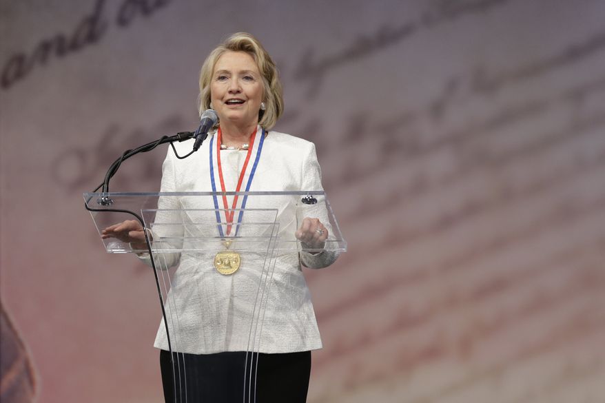 Former Secretary of State Hillary Rodham Clinton speaks after receiving the Liberty Medal during a ceremony at the National Constitution Center, Tuesday, Sept. 10, 2013, in Philadelphia. The honor is given annually to an individual who displays courage and conviction while striving to secure liberty for people worldwide. (AP Photo/Matt Rourke)
