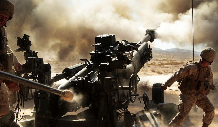 Marines with Battery N, 5th Battalion, 14th Marine Regiment, fire an M777 A2 howitzer during a series of integrated firing exercises at the Marine Corps Air Ground Combat Centter Twentynine Palms&#x27; Quakenbush Training Area April 26, 2013. (credit: U.S. Marine Corps)
