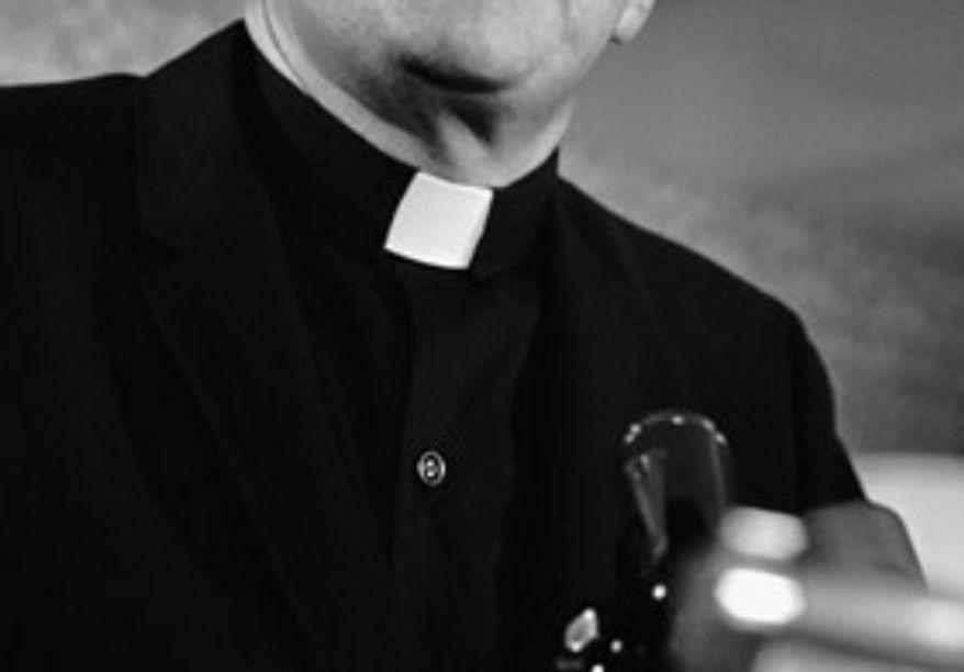 ** FILE ** Catholic priest (Associated Press)