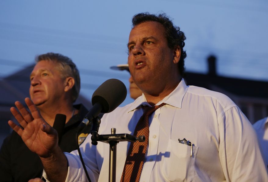 New Jersey Gov. Chris Christie addresses the media near the area hit by a massive fire on Thursday, Sept. 12, 2013, in Seaside Park, N.J. The fire began in a frozen custard stand on the Seaside Park section of the boardwalk and quickly spread north into neighboring Seaside Heights. (AP Photo/Julio Cortez)