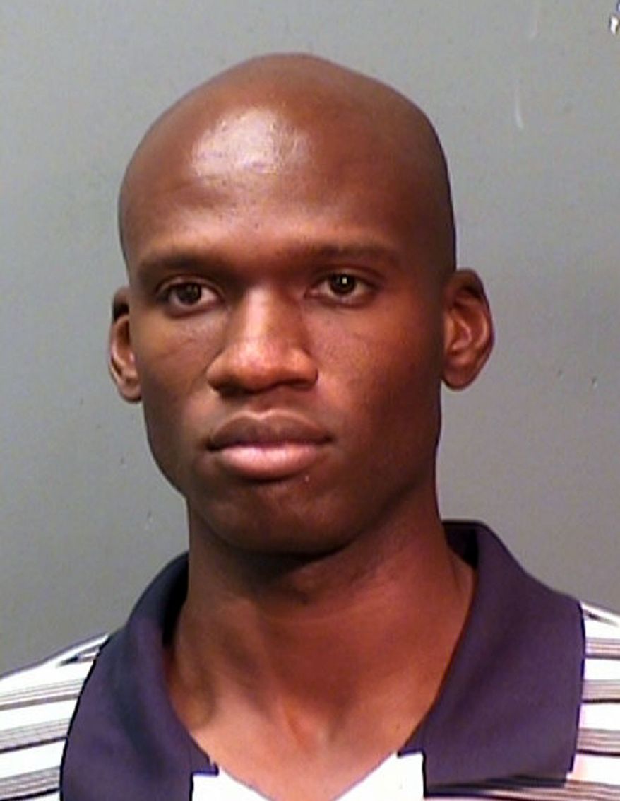 This booking photo provided by the Fort Worth Police Department shows Aaron Alexis, arrested in September 2010, on suspicion of discharging a firearm in the city limits. The FBI has identified Alexis, 34, as the gunman in the Sept. 16, 2013 shooting rampage at at the Washington Navy Yard in Washington that left thirteen dead, including himself. (Associated Press/Fort Worth Police Department)