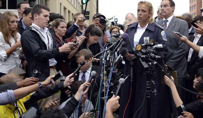 District of Columbia Police Chief Cathy Lanier briefs reporters on the shooting at the Washington Navy Yard in Washington, Monday, Sept. 16, 2013. Standing to the right of Lanier is District of Columbia Mayor Vincent Gray. At least one gunman opened fire inside a building at the Washington Navy Yard on Monday morning (AP Photo/Susan Walsh)