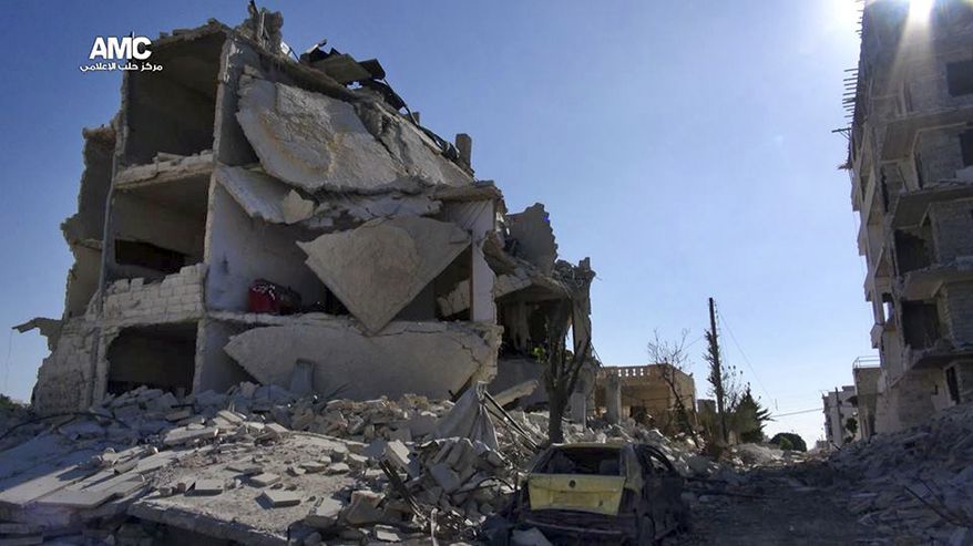 This Monday, Sept. 16, 2013, citizen journalism image provided by Aleppo Media Center AMC, which has been authenticated based on its contents and other AP reporting, shows damaged buildings due to heavy fighting between government forces and Free Syrian Army fighters in Aleppo. (AP Photo/Aleppo Media Center, AMC)