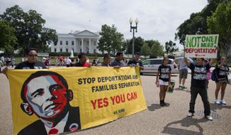 **FILE** Demonstrators rally in front of the White House in Washington on July 24, 2013, calling for immigration reform. The demonstrators urged President Obama to use executive authority to expand the policy that allowed hundreds of thousands of illegal immigrants who came to the United States as children to remain. (Associated Press)