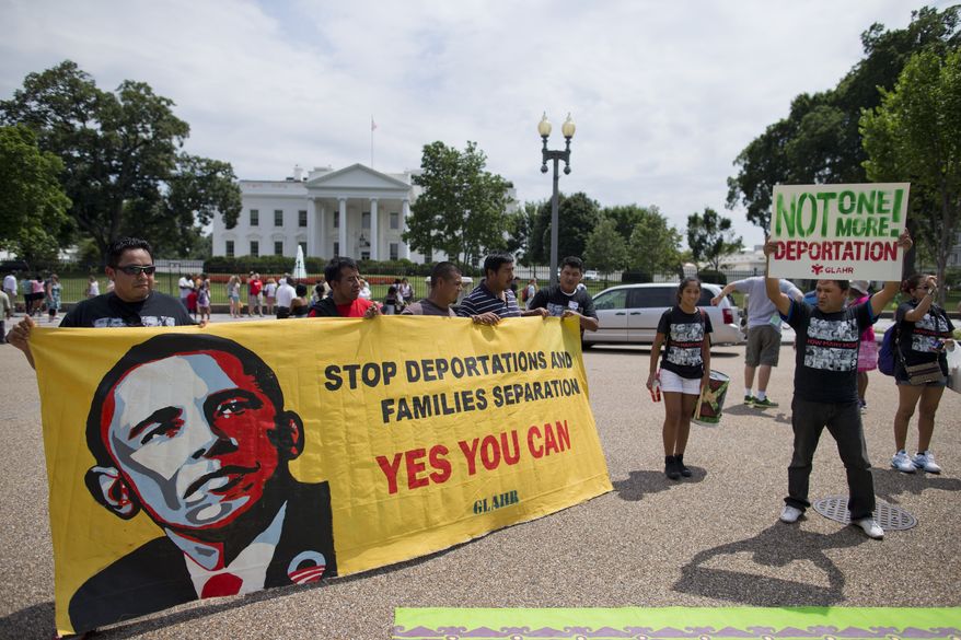 **FILE** Demonstrators rally in front of the White House in Washington on July 24, 2013, calling for immigration reform. The demonstrators urged President Obama to use executive authority to expand the policy that allowed hundreds of thousands of illegal immigrants who came to the United States as children to remain. (Associated Press)