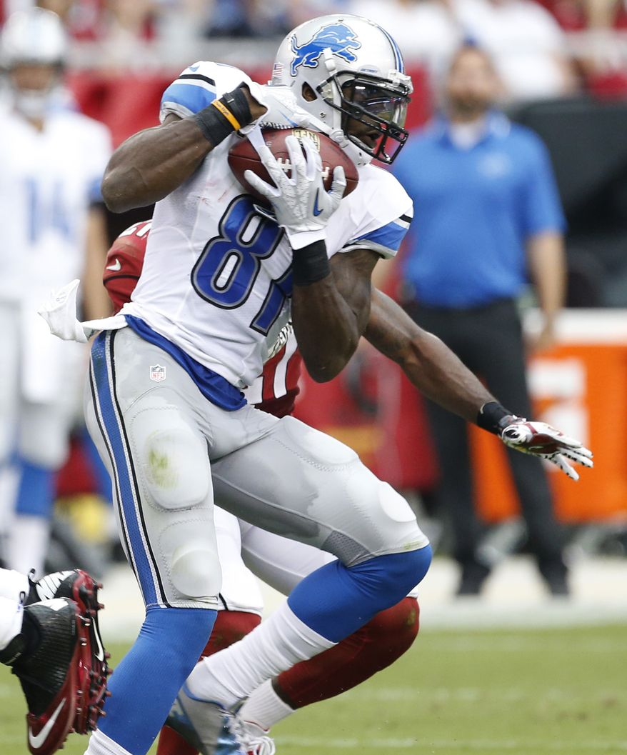 Detroit Lions wide receiver Calvin Johnson (81) makes a catch for a touchdown against the Arizona Cardinals during the first half of a NFL football game, Sunday, Sept. 15, 2013, in Glendale, Ariz. (AP Photo/Darryl Webb) 