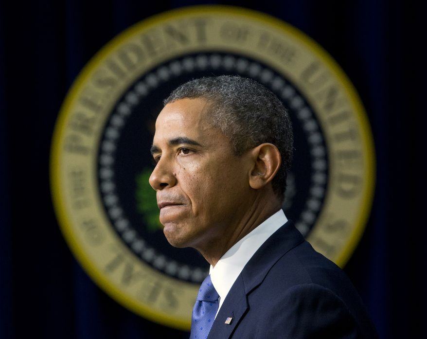 President Obama pauses as he speaks in the South Court Auditorium of the White House complex on Monday, Sept. 16, 2013, in Washington. Before speaking about the economy, Mr. Obama spoke on the shooting at the Washington Navy Yard, mourning what he called "yet another mass shooting" that he said took the life of American patriots. (AP Photo/Pablo Martinez Monsivais)