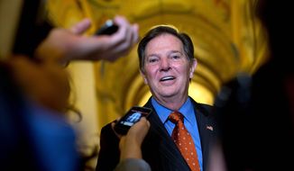** FILE ** Former House Majority Leader Tom DeLay talks to reporters as he leaves a lunch meeting on Capitol Hill, Thursday, Sept. 19, 2013, in Washington. A Texas appeals court tossed the criminal conviction of DeLay on Thursday, Sept. 19, 2013, saying there was insufficient evidence for a jury in 2010 to have found him guilty of illegally funneling money to Republican candidates. (AP Photo/Carolyn Kaster)