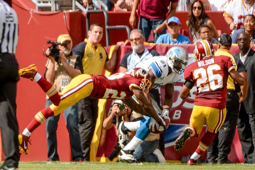 Washington Redskins cornerback DeAngelo Hall (23) breaks up a pass intended for Detroit Lions wide receiver Calvin Johnson (81) in the second quarter as the Washington Redskins play the Detroit Lions in NFL football at FedExField, Landover, Md., Monday, September 9, 2013. (Andrew Harnik/The Washington Times)