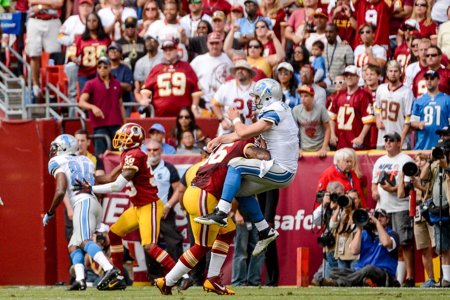 Washington Redskins inside linebacker Perry Riley (56) hits Detroit Lions quarterback Matthew Stafford (9) as he throws at the end of the second quarter as the Washington Redskins play the Detroit Lions in NFL football at FedExField, Landover, Md., Monday, September 9, 2013. (Andrew Harnik/The Washington Times)