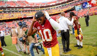 Washington Redskins quarterback Robert Griffin III (10) walks off the field as the Washington Redskins lose to the Detroit Lions 27-20 in NFL football at FedExField, Landover, Md., Monday, September 9, 2013. (Andrew Harnik/The Washington Times)