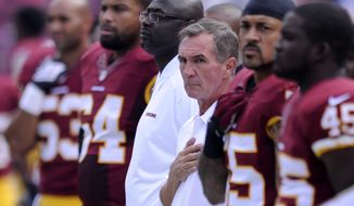 Washington Redskins head coach Mike Shanahan joins his team on the sidelines for the National Anthem before the Washington Redskins play the Detroit Lions at FedExField, Landover, Md., September 22, 2013. (Preston Keres/Special for The Washington Times)