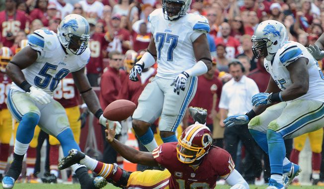 Washington Redskins quarterback Robert Griffin III (10)fumbles during the fourth quarter as the Washington Redskins play the Detroit Lions at FedExField, Landover, Md., September 22, 2013. (Dan DeCook/Special for The Washington Times)
