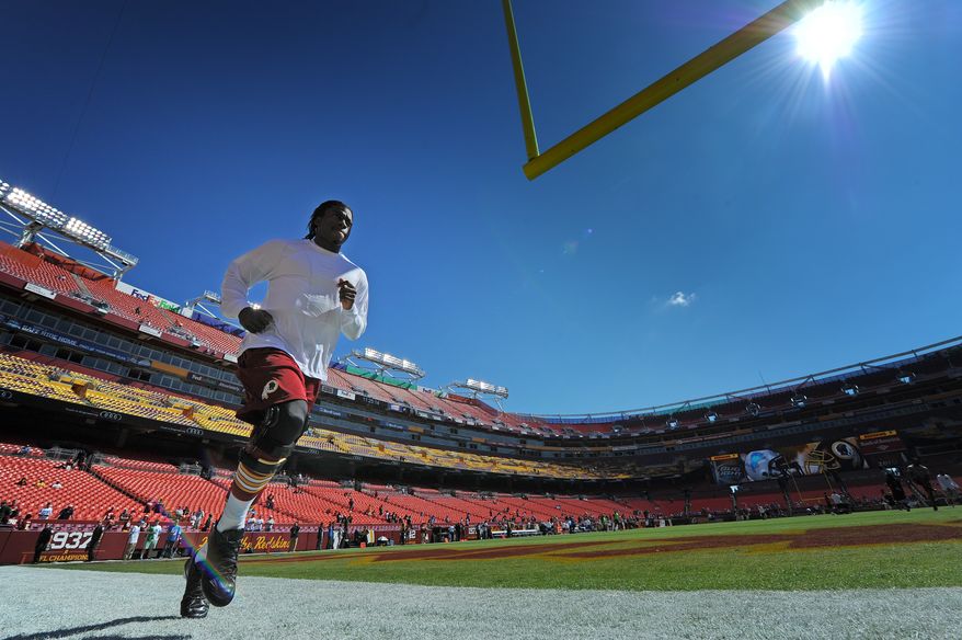 Washington Redskins quarterback Robert Griffin III  warms up during pregame before his Washington Redskins play the Detroit Lions at FedExField, Landover, Md., September 22, 2013. (Preston Keres/Special for The Washington Times)