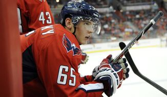 Washington Capitals left wing Andre Burakovsky (65), of Austria, looks on during the first period an NHL preseason hockey game against the Chicago Blackhawks, Friday, Sept. 20, 2013, in Washington. (AP Photo/Nick Wass)