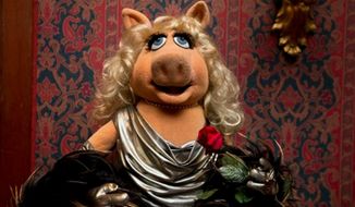 A Miss Piggy muppet, that was used on &quot;The Muppet Show,&quot; is all dressed up during a ceremony to donate additional Jim Henson objects to the Smithsonian&#39;s National Museum of American History in Washington, Tuesday, Sept. 24, 2013. (Associated Press)