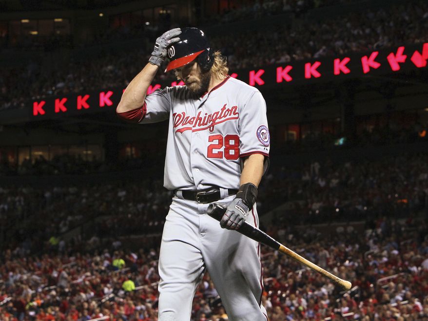 Jayson Werth walks off the field after an at-bat in Monday's 4-3 loss to the Cardinals. The Washington Nationals were eliminated from postseason contention with the defeat. (Associated Press photo)